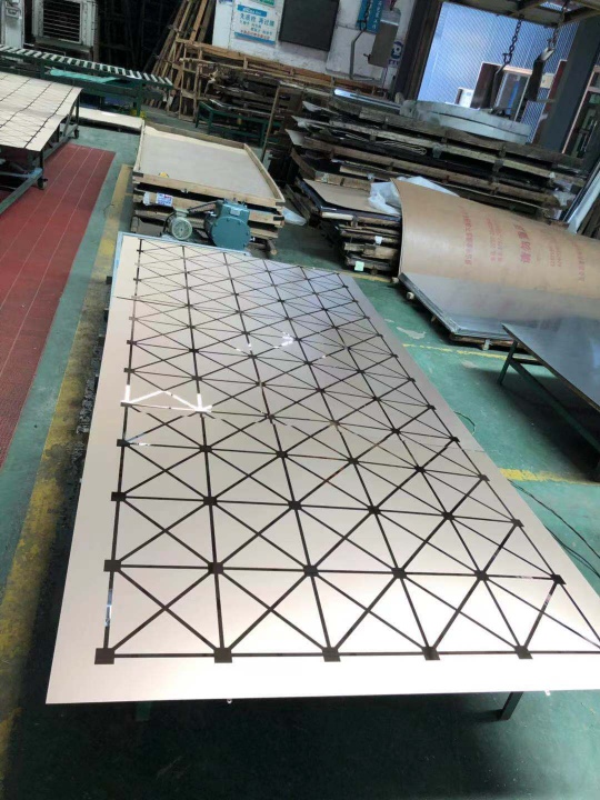 Metal etching for stainless steel wall panels