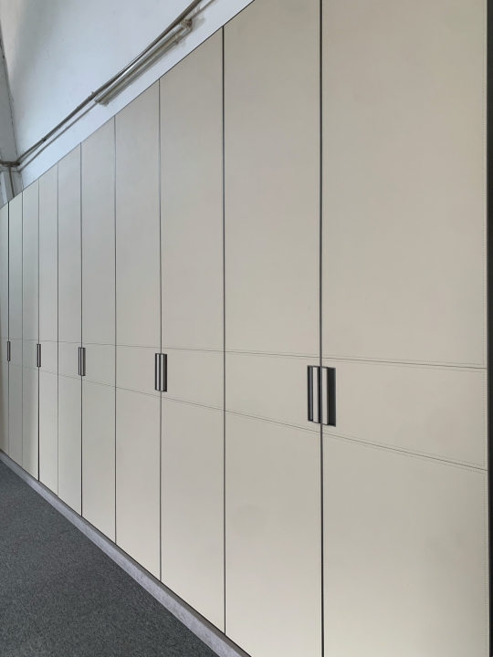 Off-white lychee-patterned leather wardrobe doors